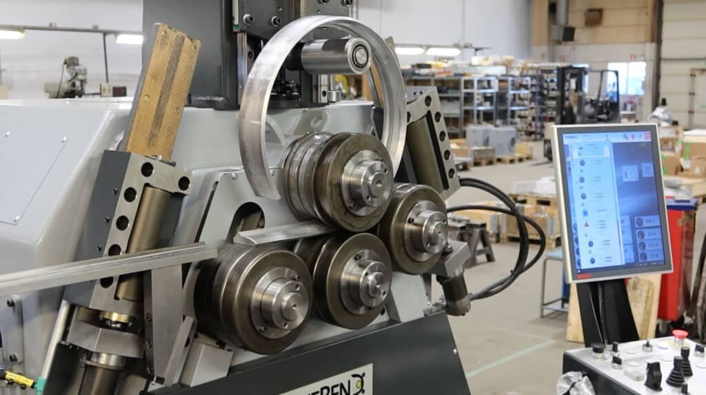 Extruded aluminium profiles being section bent into shroud rings on a SweBend SB4-65S