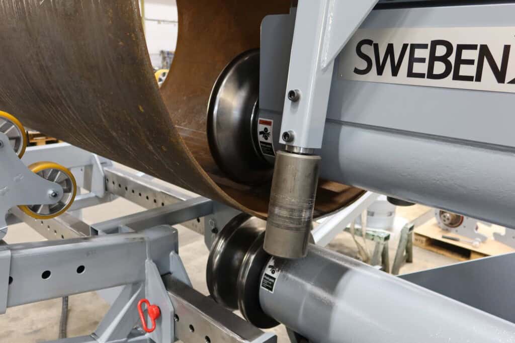 SweBend JM-140 joggling machine profiled forming rolls pressing a groove into a heavy-wall steel cylinder