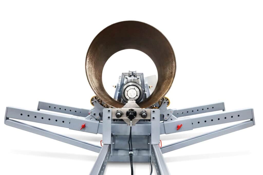 End-on view of the SweBend JM-140 joggling machine with a steel pressure vessel cylinder loaded between support rolls