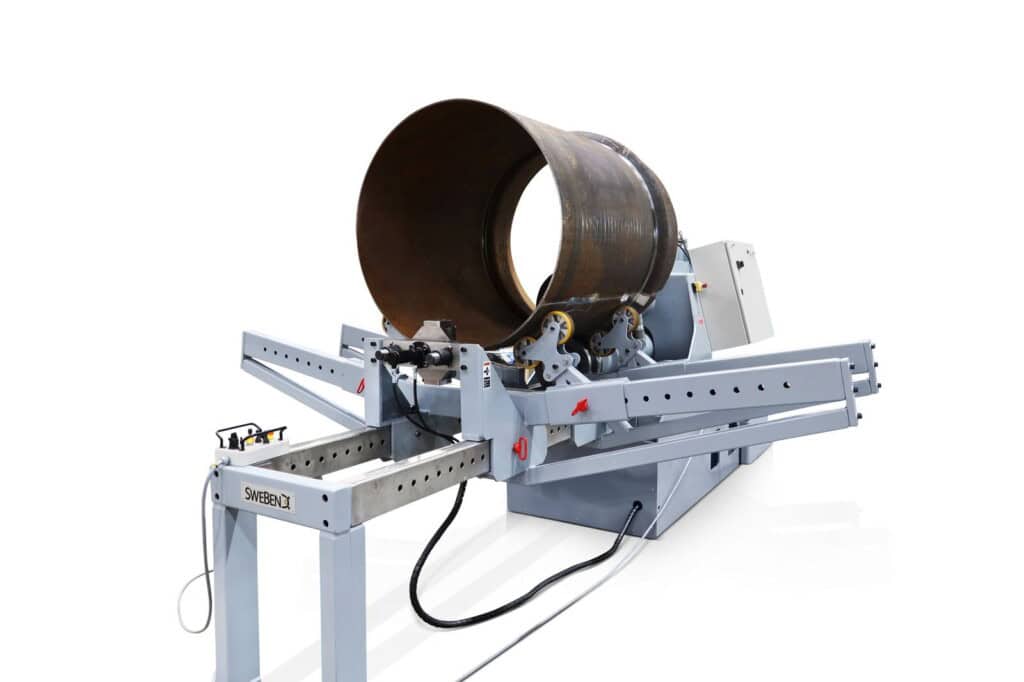 Full view of the SweBend JM-140 joggling machine with control cabinet, drive end, and outboard support rail