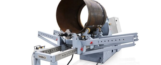 Full view of the SweBend JM-140 joggling machine with control cabinet, drive end, and outboard support rail